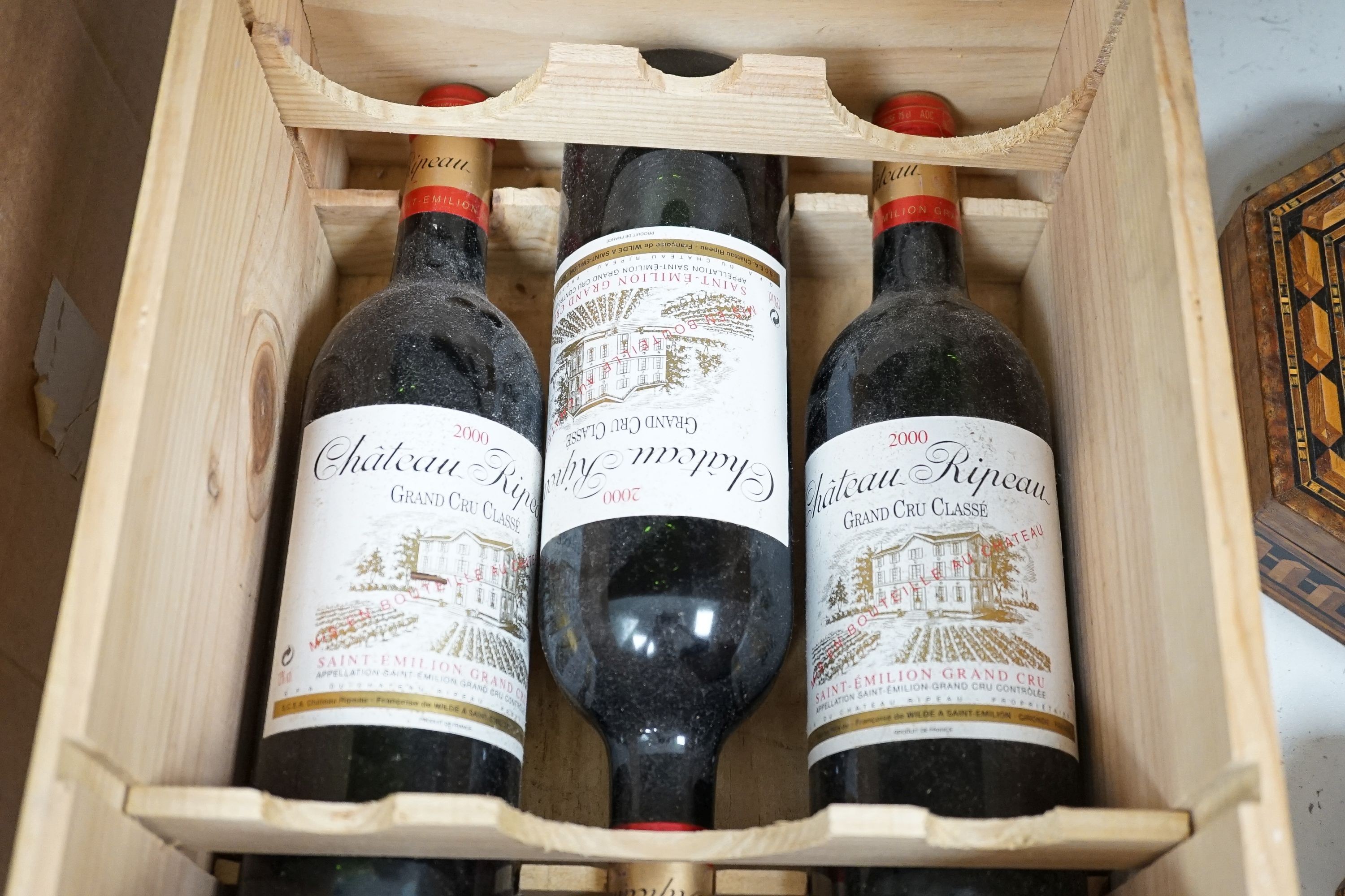 Four bottles of Chateau Ripeau Saint Emilio Grand Cru 2000 with original wooden crate